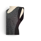 A sleeveless black and gray herringbone patterned top displayed on a cream mannequin torso against a white background.