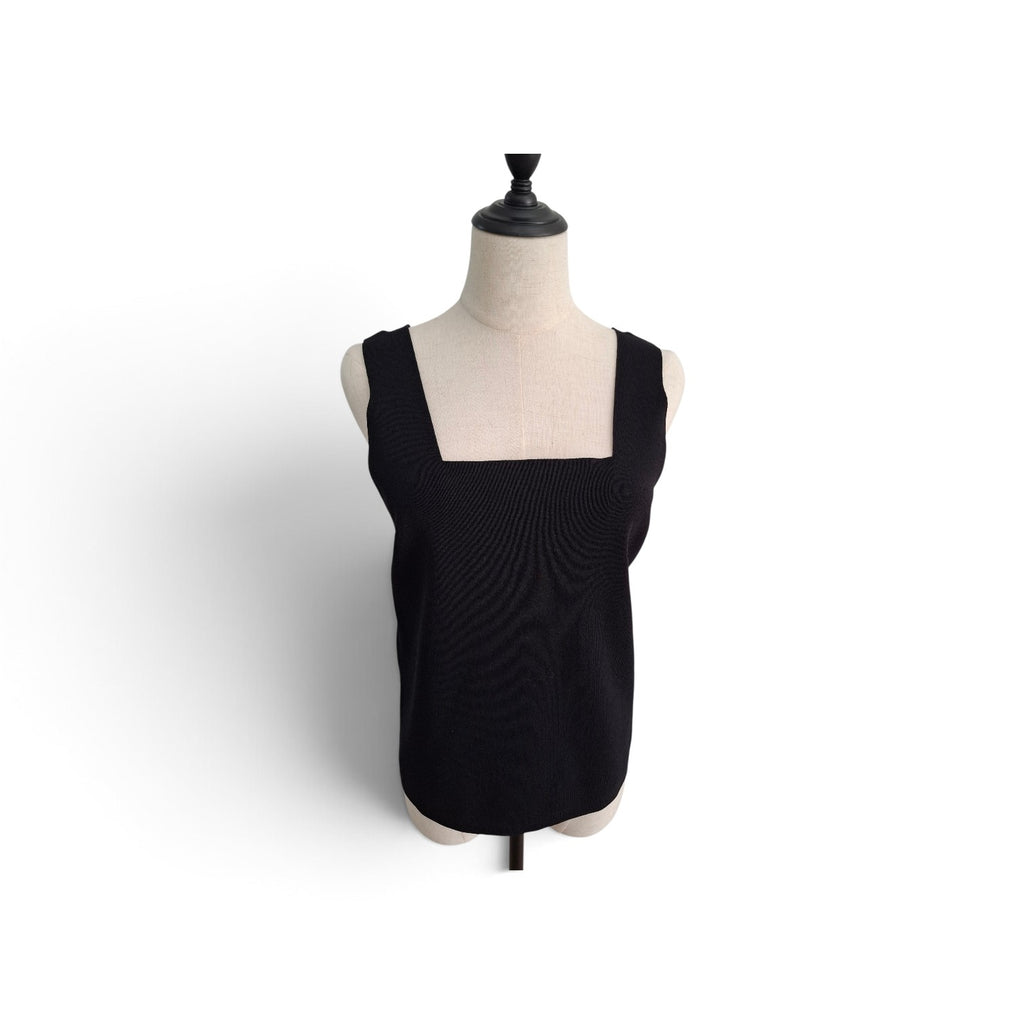 A black sleeveless knit top with a square neckline, displayed on a cream-colored dress form mannequin against a plain white background.