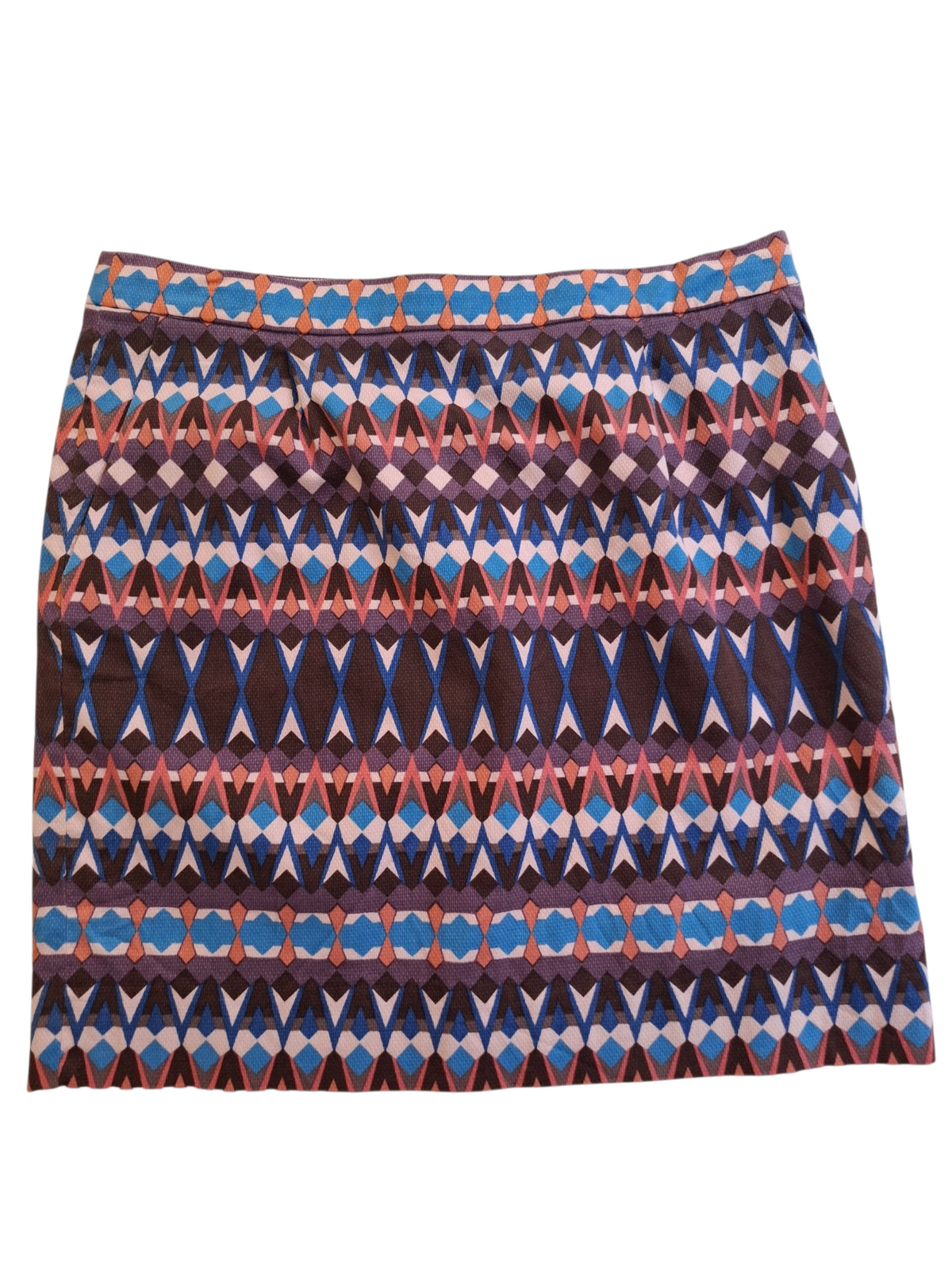 A short A-line skirt featuring a horizontal geometric pattern with blue, brown, pink, and white diamond and oval motifs.