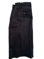 Black dress pants folded to show the back waistband, belt loops, and a buttoned welt pocket, photographed against a plain white background.