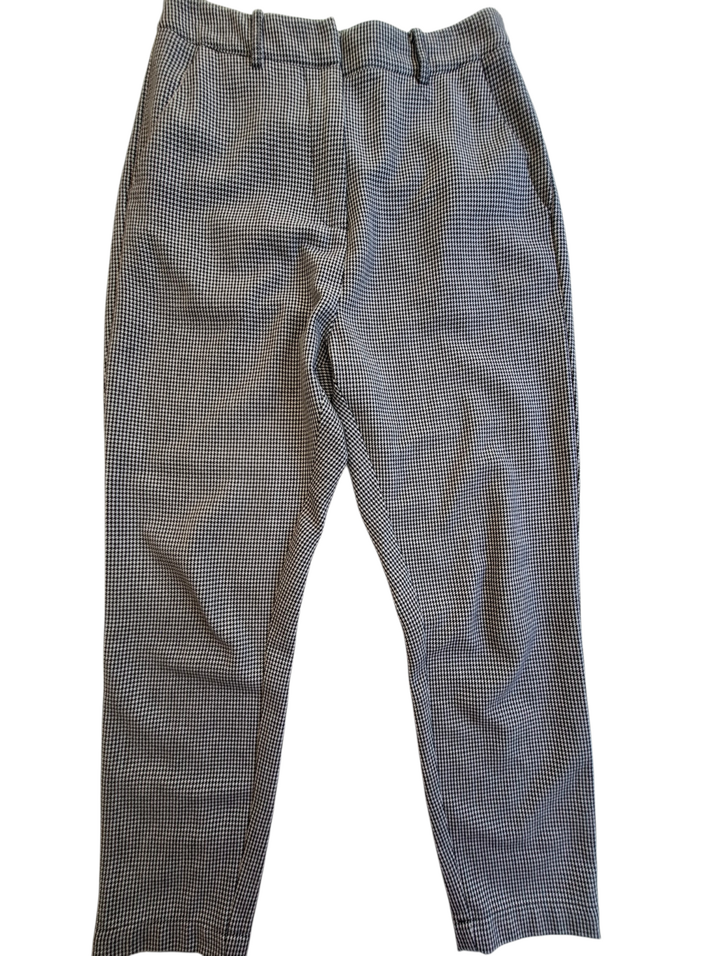 A pair of gray and black micro-check patterned trousers laid flat against a white background.