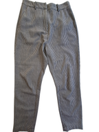 A pair of gray and black micro-check patterned trousers laid flat against a white background.