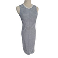 A sleeveless bodycon dress with horizontal navy and white stripes, displayed on a mannequin torso against a plain white background.