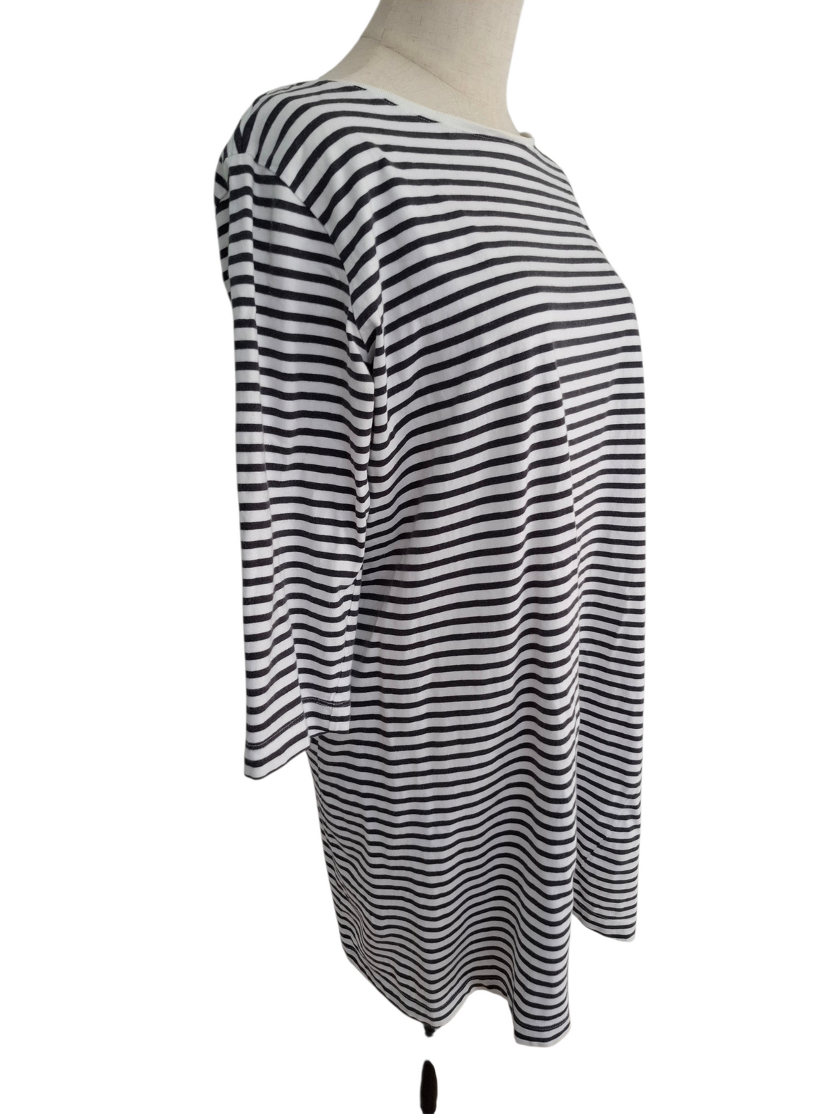 A black and white horizontally striped long-sleeve tunic top displayed on a mannequin torso against a plain white background.