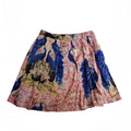 A flared A-line skirt featuring a vibrant peacock print with blue peacocks, pink cherry blossoms, and beige foliage on a white background.