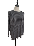 A black and white horizontally striped long-sleeve top displayed on a dress form mannequin against a plain white background.