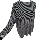 A black and white horizontally striped long-sleeve top displayed on a white background.