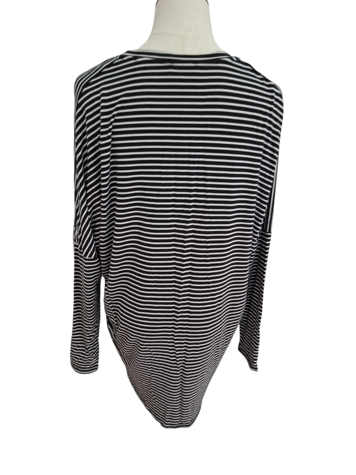 A black and white horizontally striped long-sleeve top displayed on a mannequin torso against a plain white background.