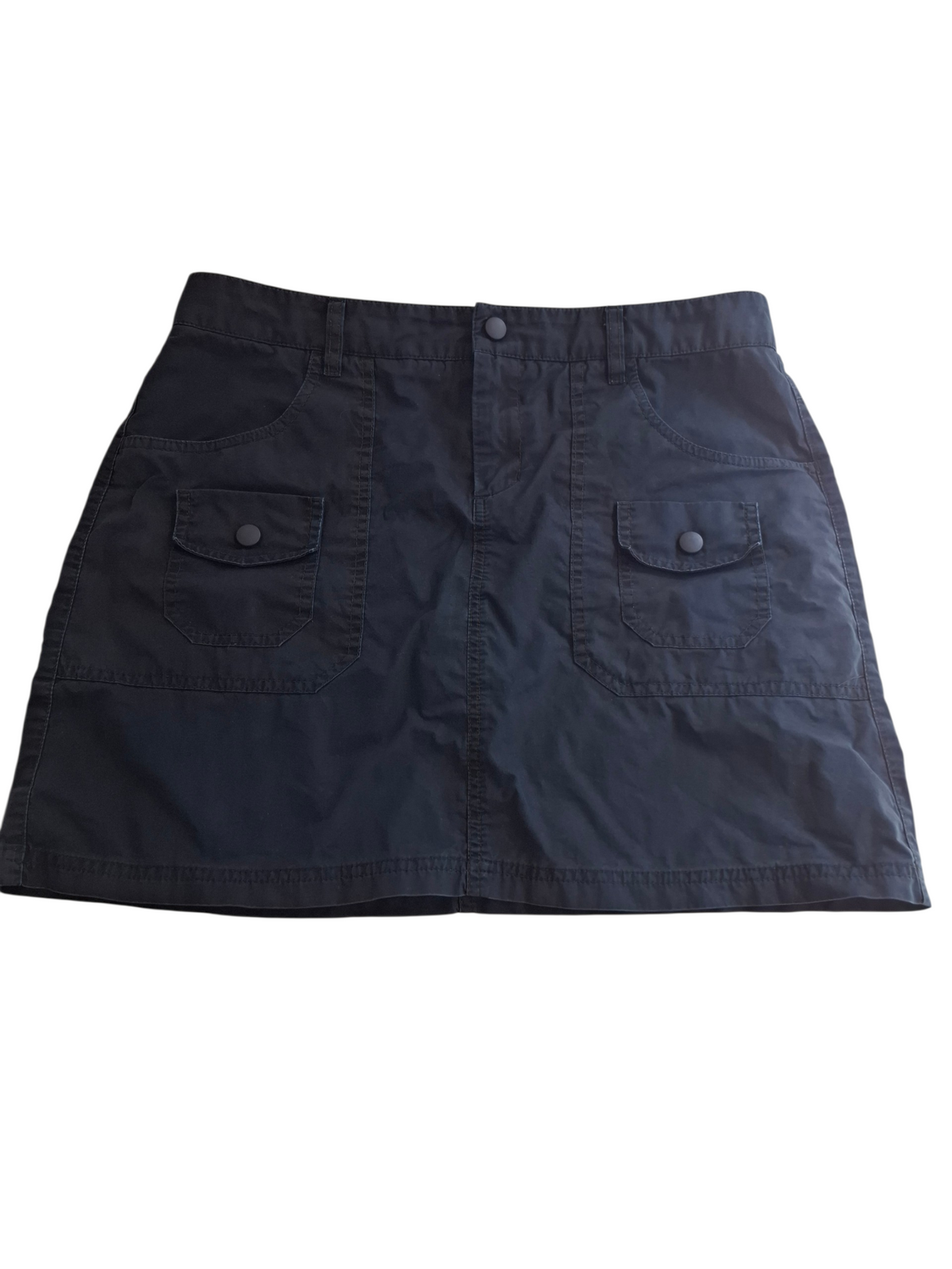 A dark navy blue mini skirt with a button closure and two front flap pockets, laid flat against a white background.