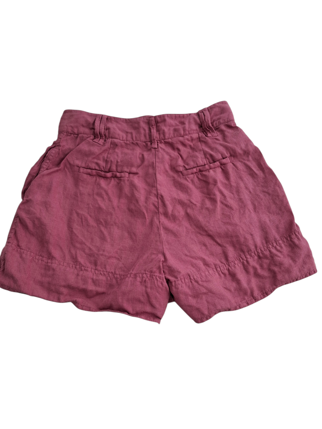 A pair of dusty rose or mauve-colored linen shorts with a gathered elastic waistband and two back welt pockets, shown flat against a white background.
