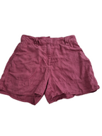 A pair of women's shorts in a dusty rose or mauve color, laid flat against a solid white background.
