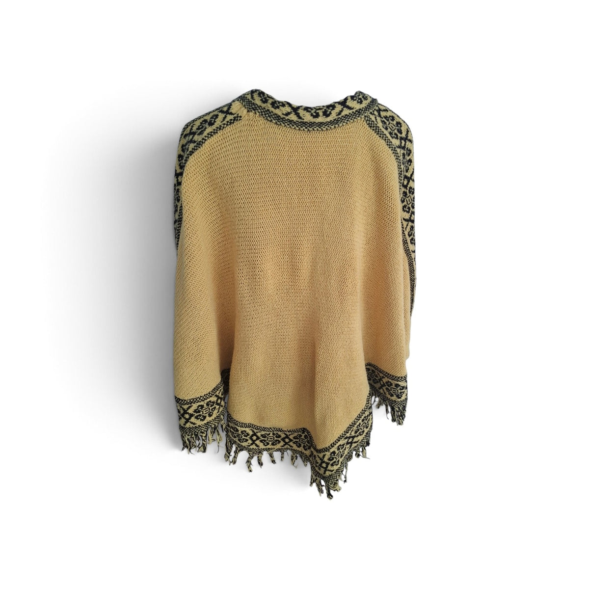 A tan knit poncho sweater with black and olive green geometric patterned trim along the collar, sleeves, hem, and fringe, displayed against a plain white background.