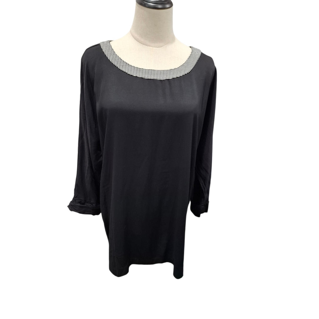 A black long-sleeve tunic top with a textured silver-gray beaded neckline, displayed on a mannequin torso against a white background.