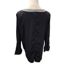 A black long-sleeve blouse displayed on a mannequin torso, featuring a wide silver and black checkered collar and a gathered back seam.