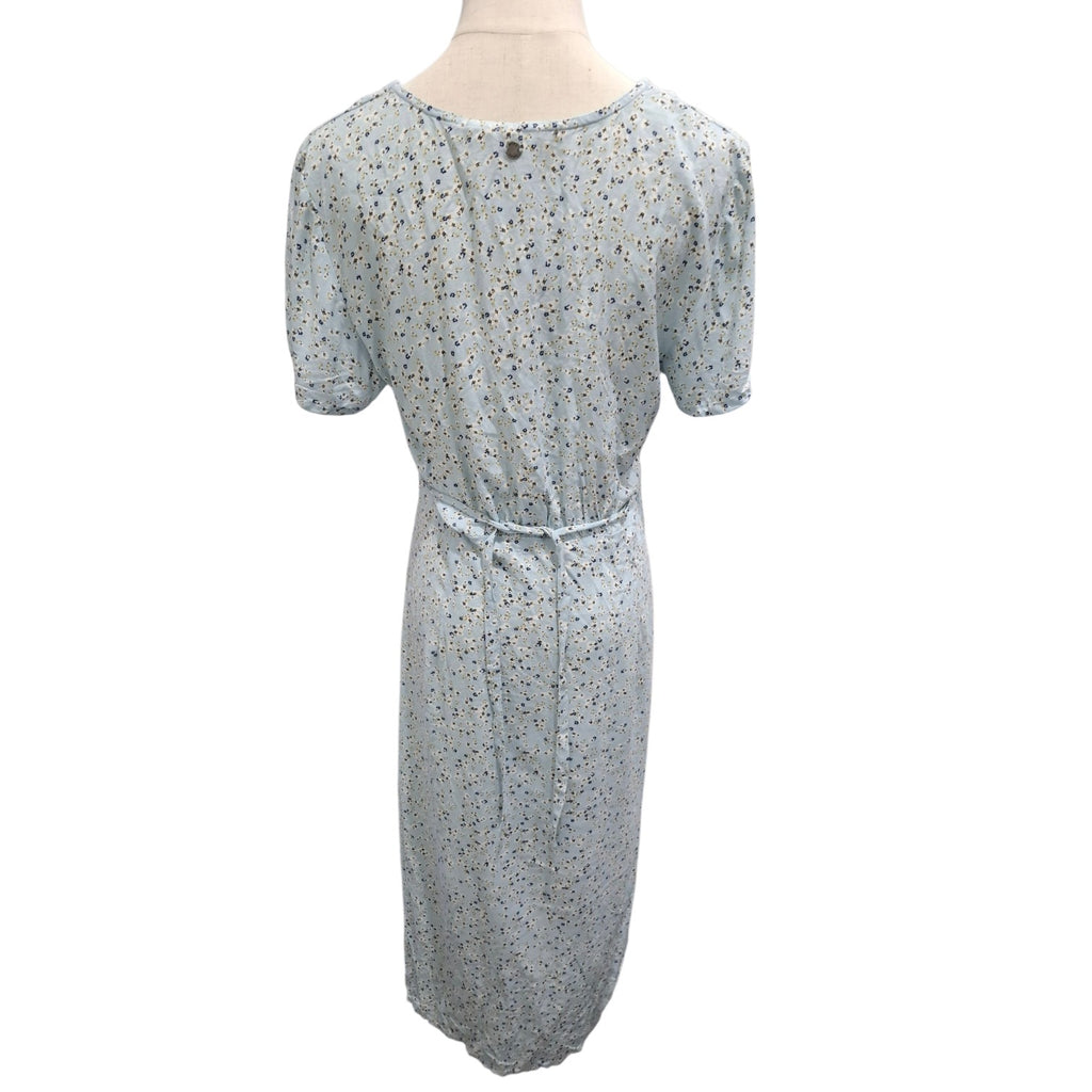 A light blue short-sleeve midi dress with a small multicolor floral print, shown from the back on a mannequin against a white background.