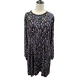 A long-sleeve tunic dress with an intricate multicolor paisley and floral pattern on a black base, displayed on a mannequin torso against a white background.