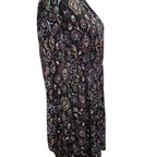 A black long-sleeve top with an all-over abstract floral and paisley print in pink, purple, white, and yellow, shown on a plain white background.