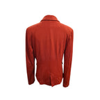 A rust-orange wool blazer shown from the back, featuring a single central seam and notch lapels, displayed on a clean white background.