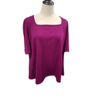 A magenta ribbed knit top with a square neckline and elbow-length sleeves, displayed on a cream mannequin torso against a white background.