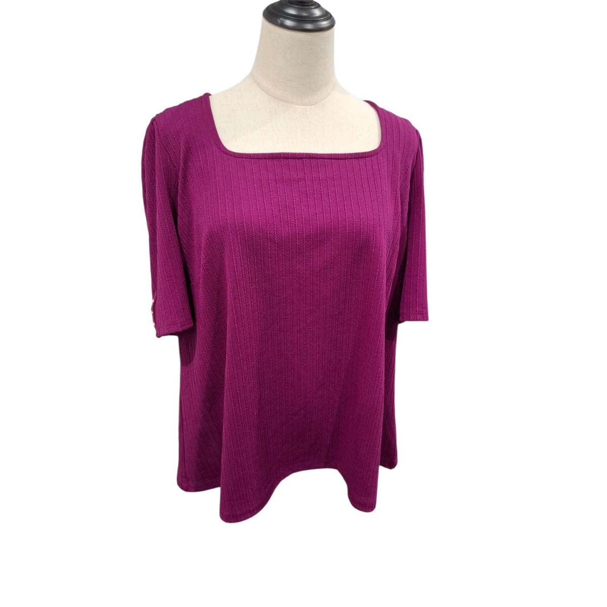 A magenta ribbed knit top with a square neckline and elbow-length sleeves, displayed on a cream mannequin torso against a white background.