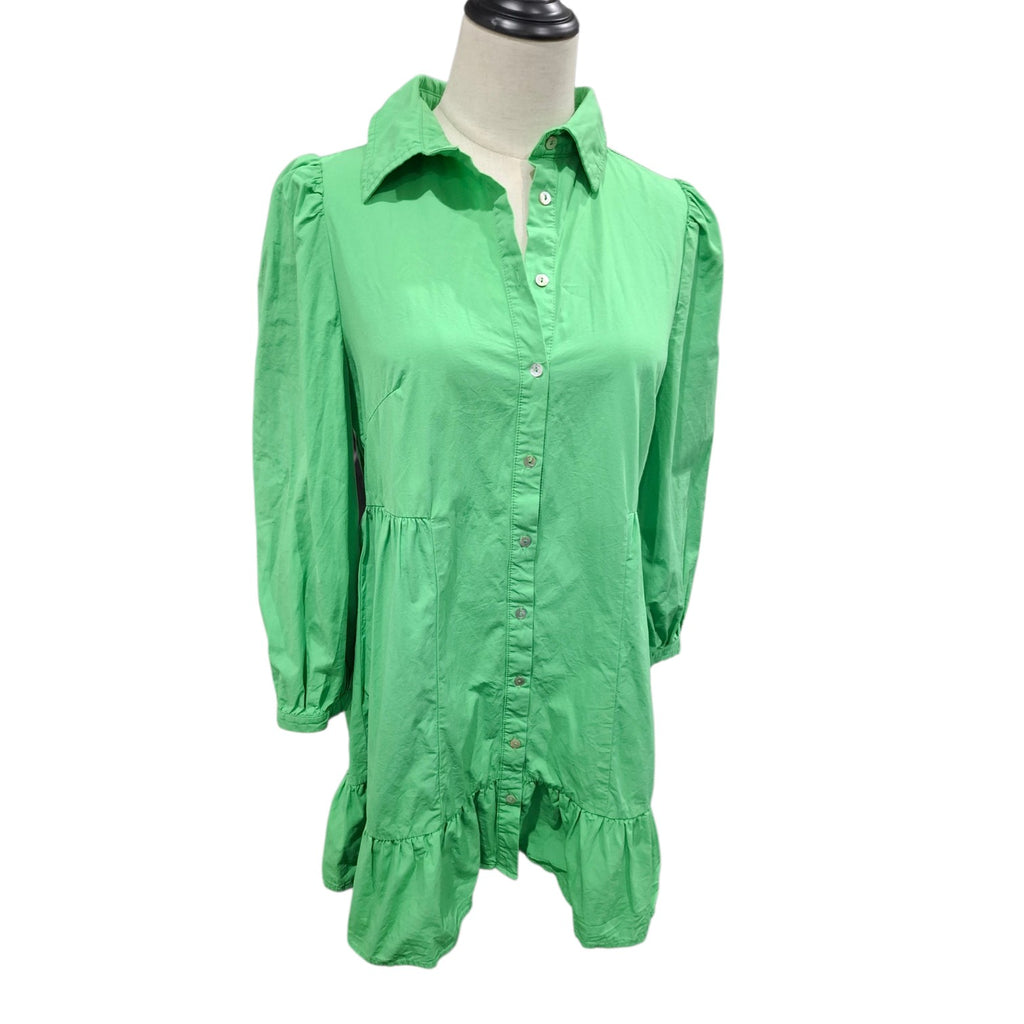 A bright green long-sleeve button-up shirt dress displayed on a mannequin torso against a plain white background.