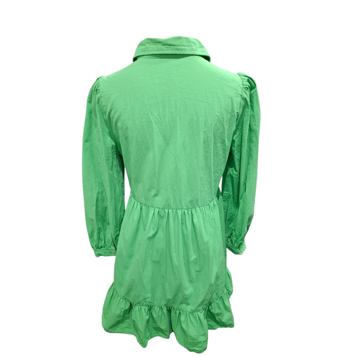 A bright green long-sleeve dress shown from the back, featuring a pointed collar, gathered waist seam, and ruffled hem, displayed on a plain white background.