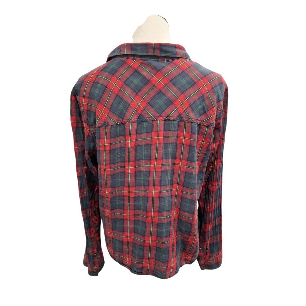 A red and navy plaid long-sleeve flannel shirt displayed on a mannequin torso against a white background.