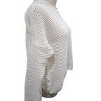 A white open-knit cropped sweater displayed on a mannequin torso against a plain white background.