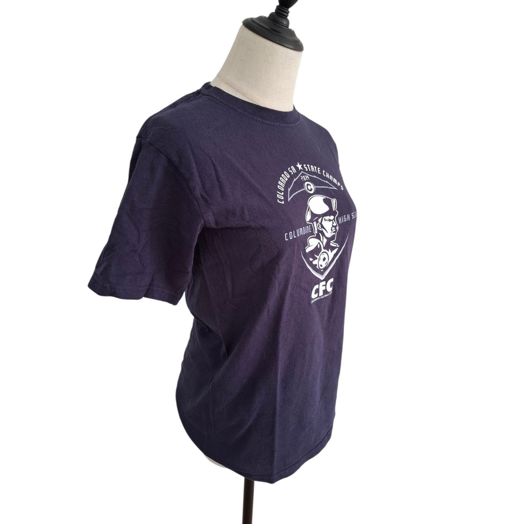 A dark purple short-sleeve t-shirt displayed on a mannequin torso against a white background. The shirt features a white graphic print on the front with the text 'CHURCHILL & LONE STAR CAMPS' and 'CFC'.