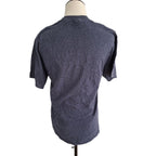 A dark heather gray short-sleeve t-shirt displayed on a mannequin torso from the back, set against a plain white background.