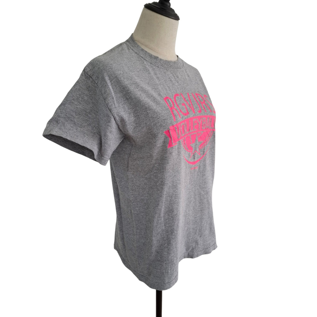 A heather gray short-sleeve t-shirt displayed on a mannequin torso against a white background. The shirt features a bright pink graphic on the front reading 'Pirates of Nantucket' in an arched font with a small ship graphic below.