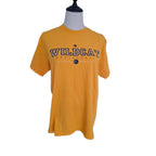 A golden yellow short-sleeve t-shirt displayed on a headless gray mannequin torso against a plain white background. The shirt features 'WILDCAT' printed across the chest in navy blue varsity lettering with a small crown graphic above it.