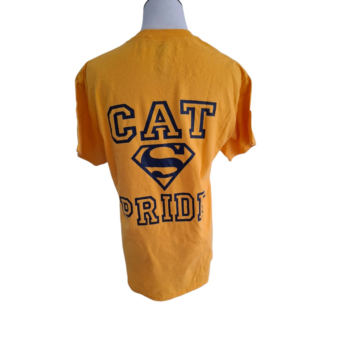 A yellow short-sleeve t-shirt displayed on a mannequin torso, showing the back graphic with 'CAT PRIDE' and a Superman-style shield logo in navy blue.