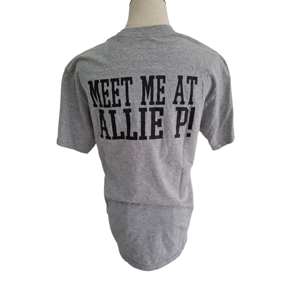 A heather gray short-sleeve t-shirt displayed on a mannequin torso, showing the back with bold black text that reads 'MEET ME AT ALLIE P!'.