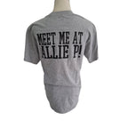 A heather gray short-sleeve t-shirt displayed on a mannequin torso, showing the back with bold black text that reads 'MEET ME AT ALLIE P!'.