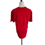 A bright red short-sleeve t-shirt displayed on a headless mannequin torso against a plain white background.