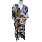 A short-sleeve V-neck kaftan dress with an abstract multicolor print, displayed on a mannequin torso against a white background.
