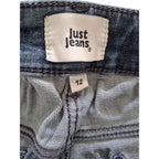 Close-up of the waistband of a pair of blue denim jeans, showing the white 'Just Jeans' brand label and a size '12' tag.