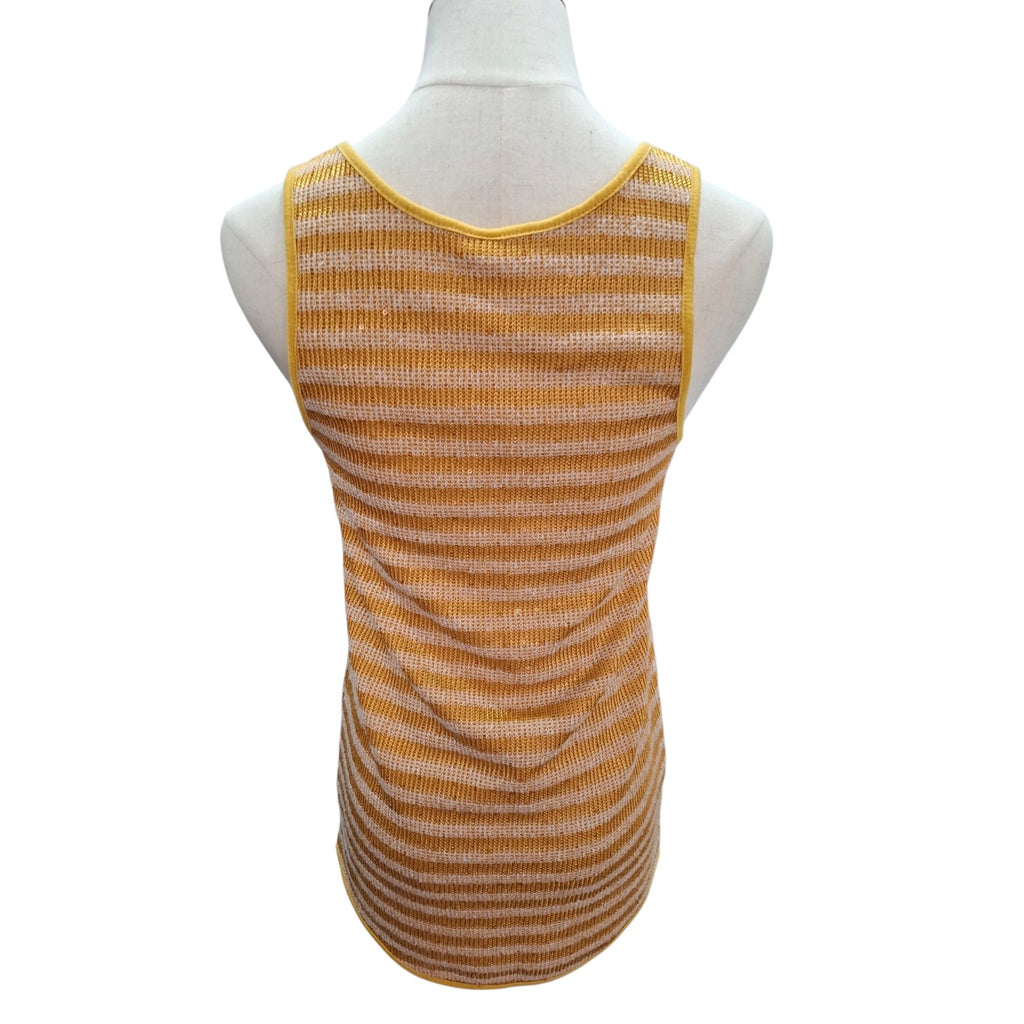 A sleeveless ribbed knit top in a warm mustard yellow and white stripe pattern, displayed on a white mannequin torso against a plain white background.