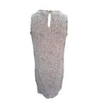 A sleeveless knit dress with an allover leopard print pattern in black and white, featuring a keyhole back neckline with tie details.