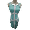 A sleeveless bodycon dress in mint green with white geometric trim and cutout details, displayed on a headless mannequin against a plain white background.