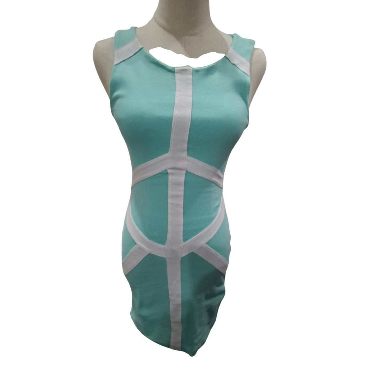 A sleeveless bodycon dress in mint green with white geometric trim and cutout details, displayed on a headless mannequin against a plain white background.