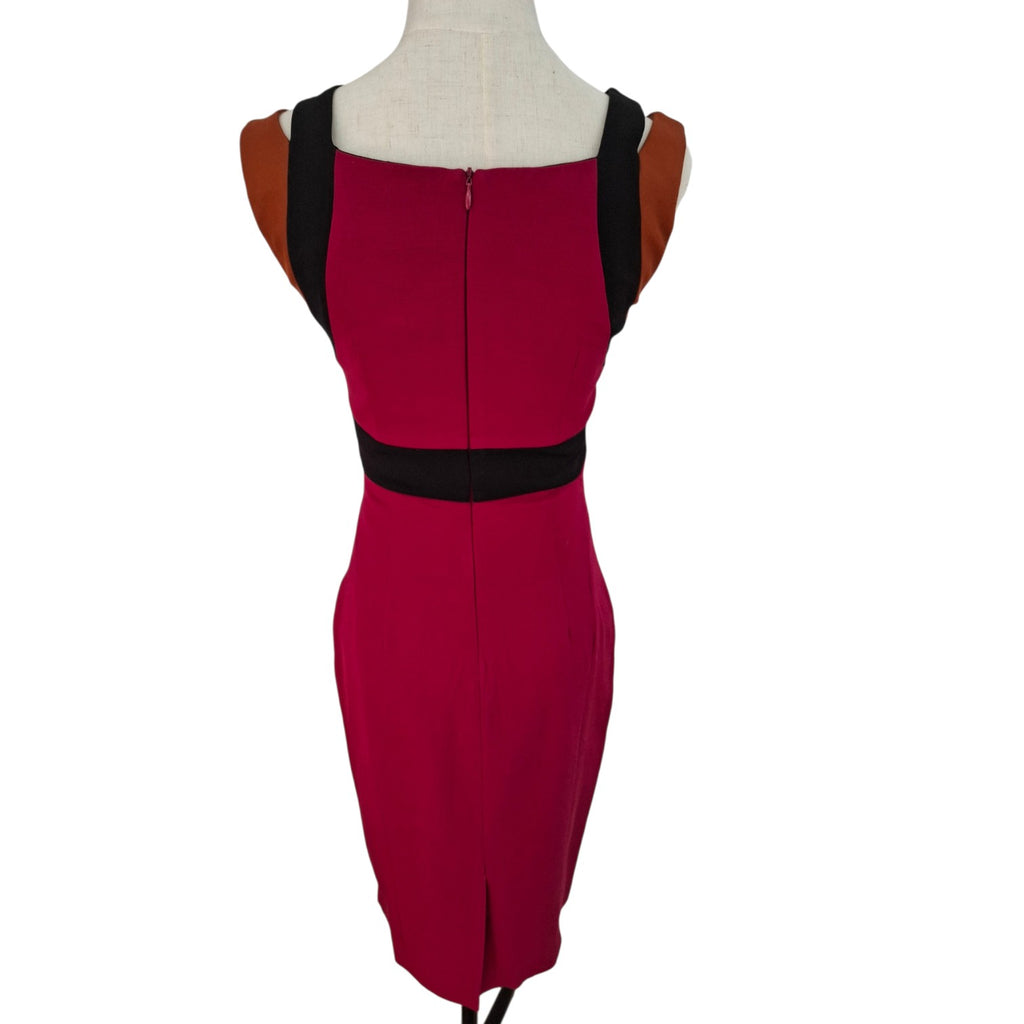 A sleeveless bodycon dress in deep magenta with black trim details, displayed on a cream mannequin torso against a white background.