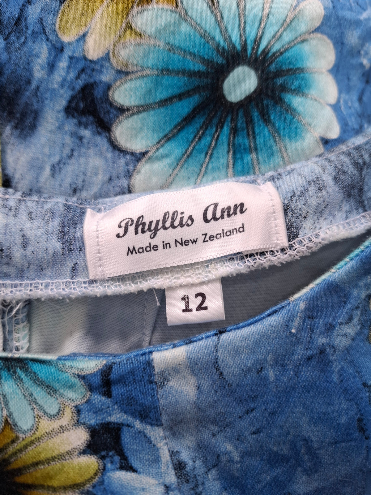 Phyllis Ann Sleeveless Blue and Yellow floral print sheath dress